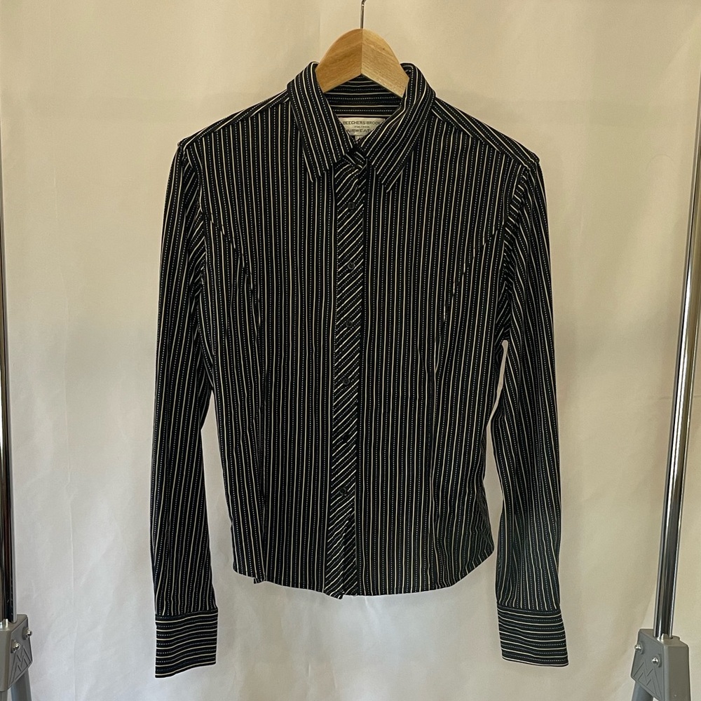 Pin striped collared shirt. Button down style.